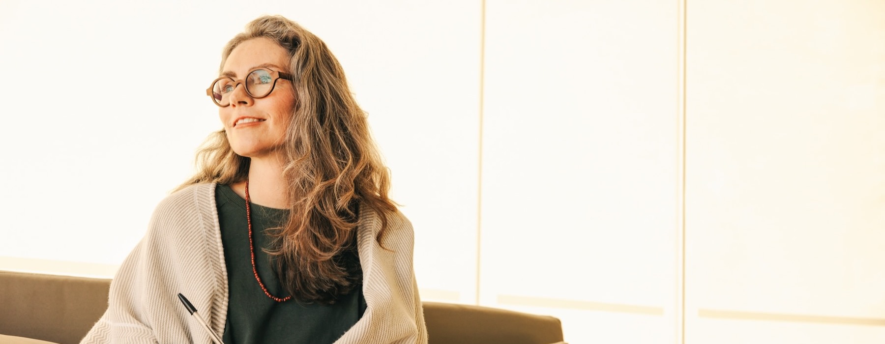 a woman sitting on a couch
