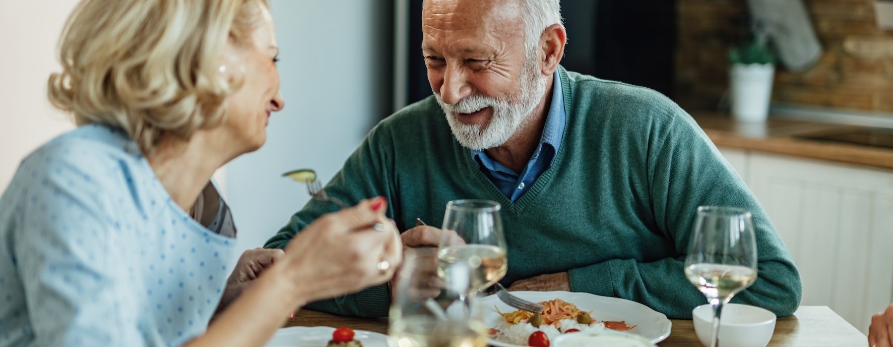 a man and a woman eating at a table