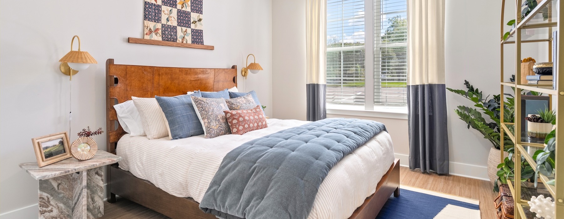 a bedroom with a large bed and a window
